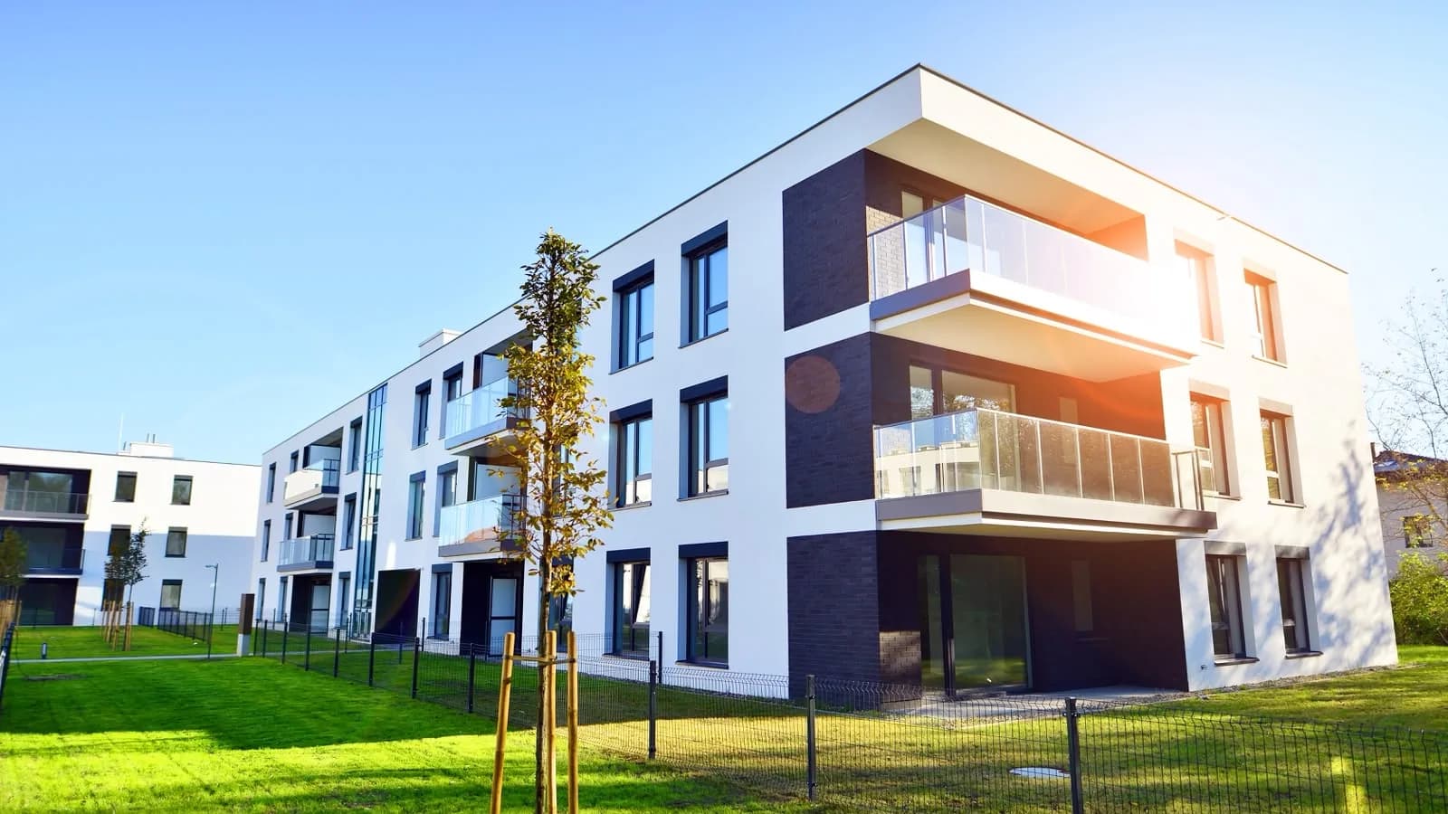 Modern apartment building with fresh white exterior walls